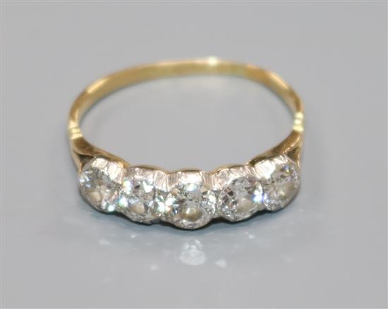 An 18ct gold and graduated five stone diamond ring, size R.